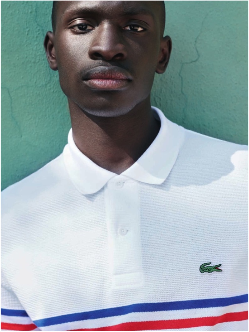 Ambroise Mendy sports a smart polo from Lacoste's spring-summer 2019 collection.