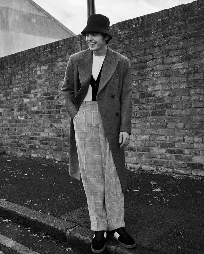 Donning a grey double-breasted coat from Zara Man, Lennon Gallagher takes to the streets of London.