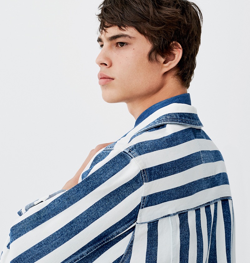 Louis Baines sports a striped denim jacket by Pull & Bear.