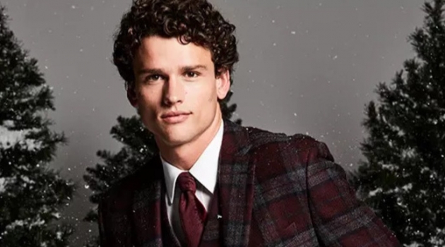 Macy's Proposes Formal Holiday Outfit Ideas Christmas Dinner: Embracing checks, Simon Nessman sports a Lauren by Ralph Lauren classic-fit tartan plaid wool sport coat and vest. He also dons a clean white dress shirt.
