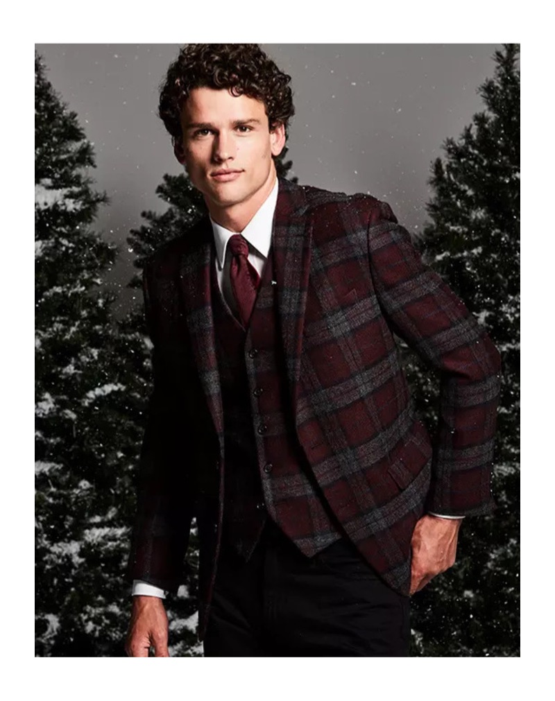 Christmas Dinner: Embracing checks, Simon Nessman sports a Lauren by Ralph Lauren classic-fit tartan plaid wool sport coat and vest. He also dons a clean white dress shirt.