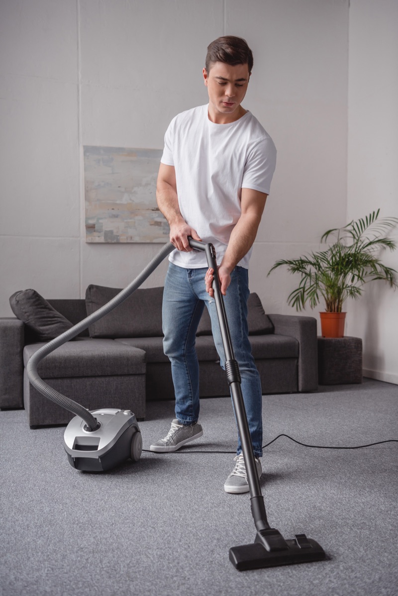 Man Cleaning Home Vacuum
