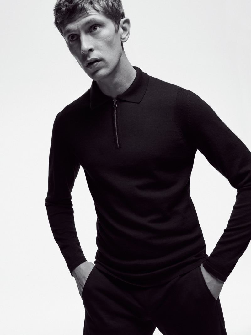 Top model Mathias Lauridsen dons a long-sleeve polo and pants from Marc O'Polo's Black Fashion Week capsule collection.