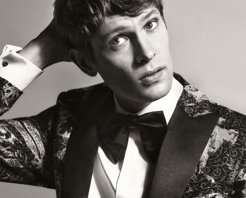 Mathias Lauridsen dons a printed tuxedo jacket, shirt, and bow-tie from Zara Man.