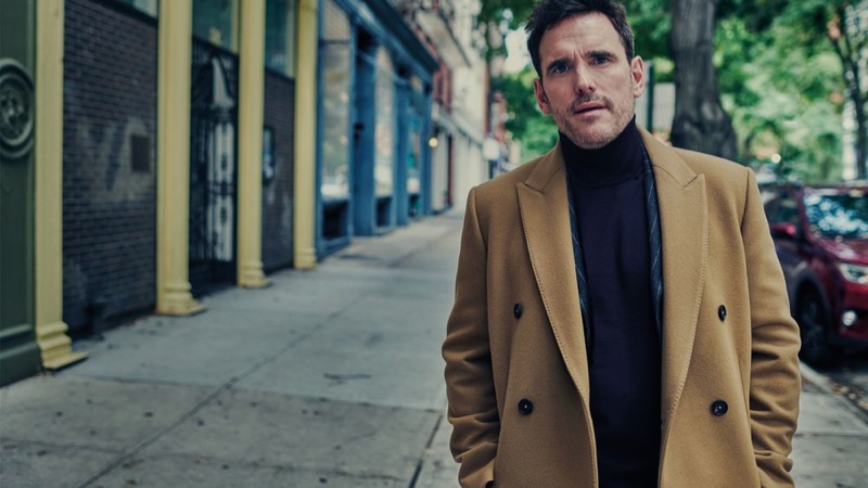 Matt Dillon dons a Salle Privée double-brested coat with a Man 1924 suit jacket and Brioni cashmere turtleneck sweater.