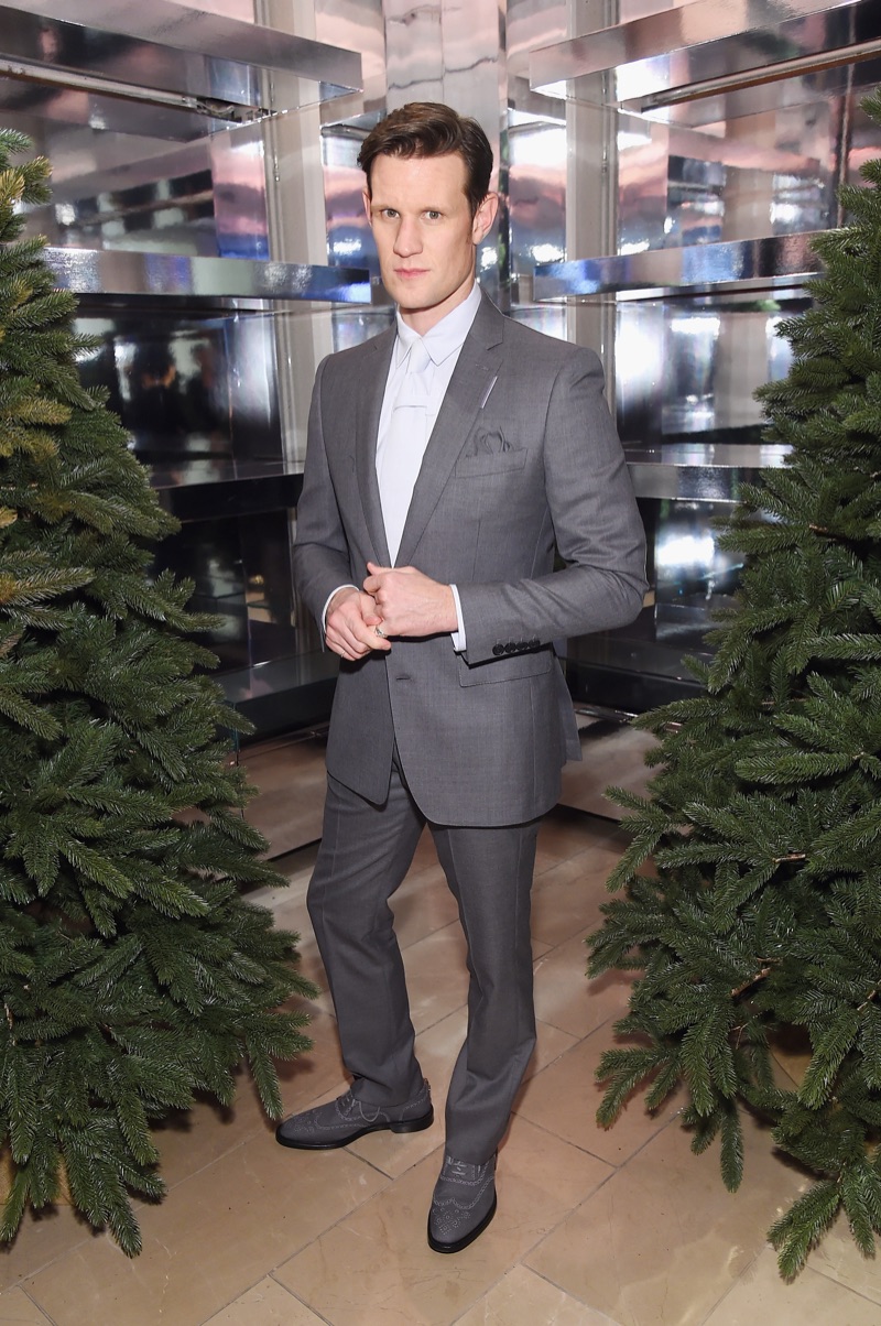 Matt Smith dons a grey suit from Burberry.