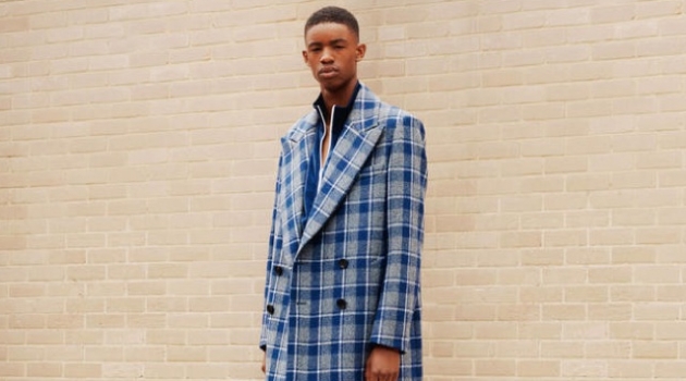 Reality Check: Montell Martin Dons Check Fashions for Harrods WOOYOUNGMI coat £1,105; PALM ANGELS tracksuit top £360 and trackpants £300; STEPHEN WEBSTER x THAMES chain necklace £600 and pendant necklace £940; NIKE socks £12.95; CHRISTIAN LOUBOUTIN sneakers £785