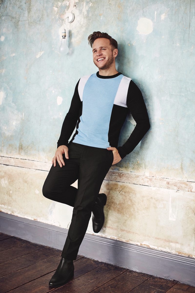 Embracing the latest fashion trends, Olly Murs dons a color block sweater from his River Island collaboration.