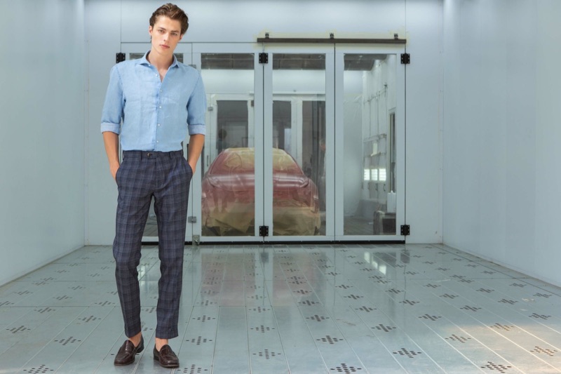 Making a checked statement, Brodie Scott wears PT Pantaloni Torino's plaid trousers.