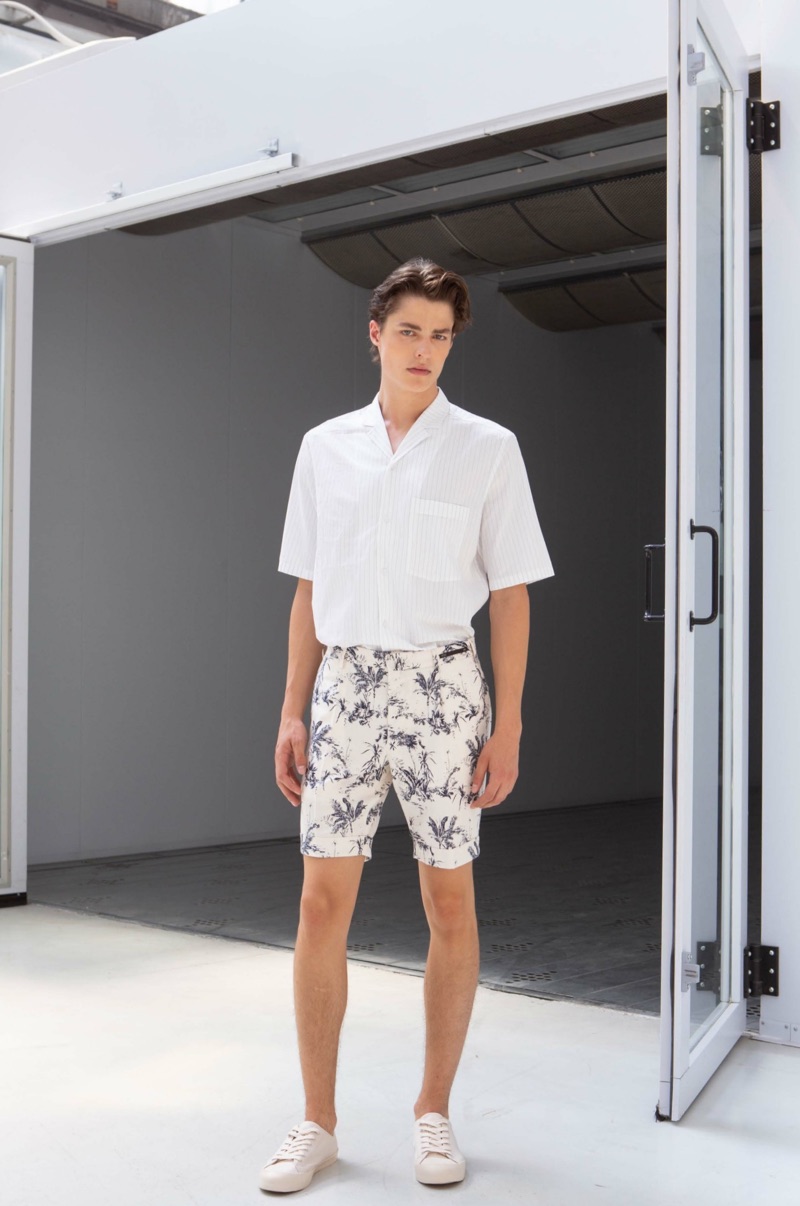Embracing chic style, Brodie Scott wears printed shorts from PT Pantaloni Torino.