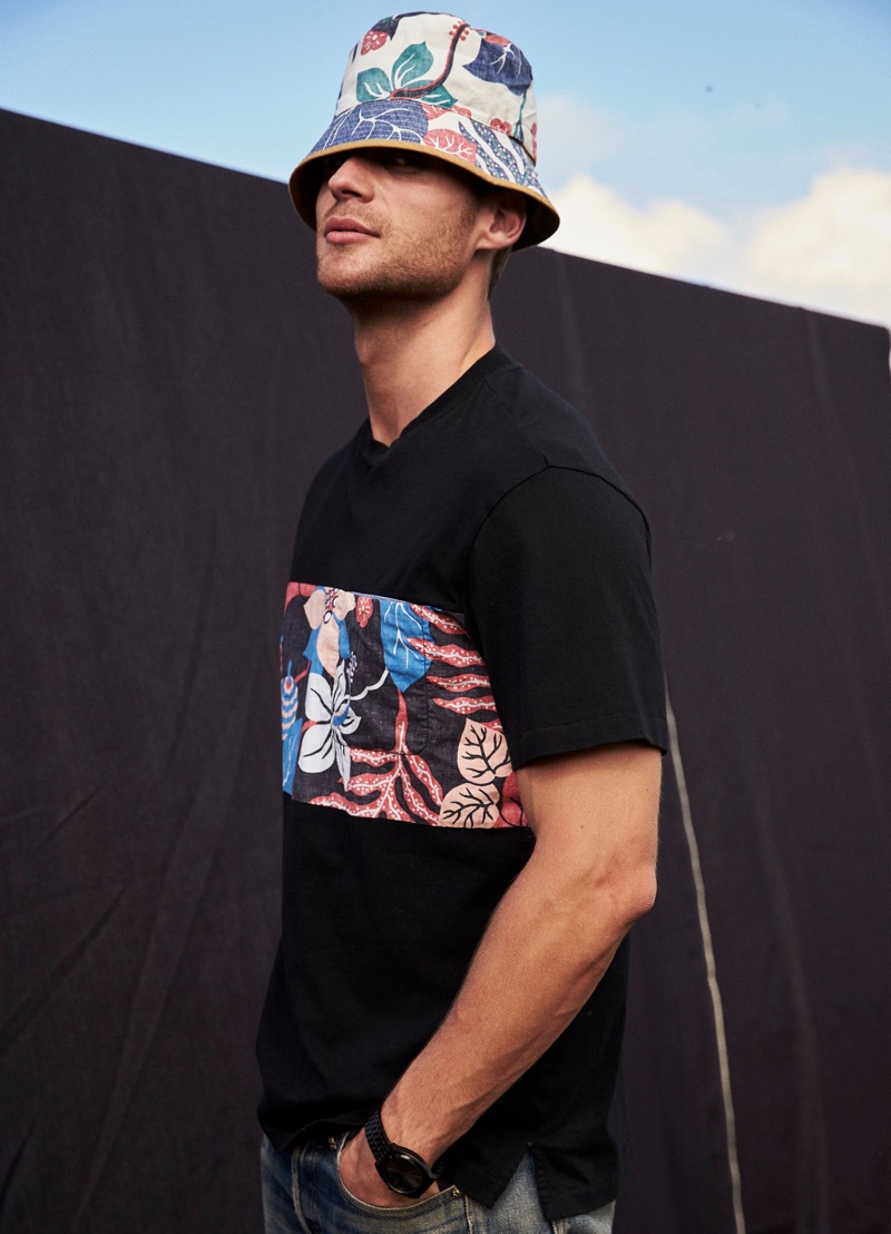 George Alsford models a graphic top and bucket hat from Reyn Spooner.