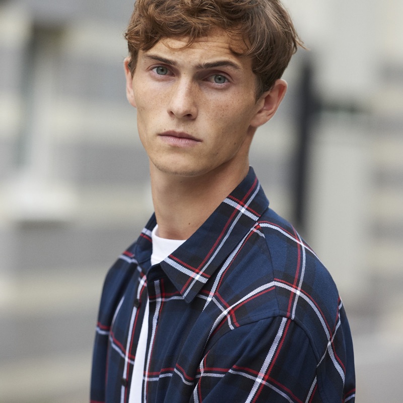 Reuniting with Sandro, Luc Defont-Saviard rocks a checked shirt.