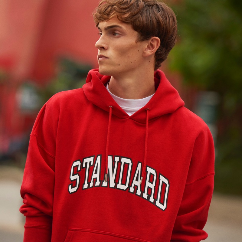 Going casual, Luc Defont-Saviard sports a "Standard" red hoodie from Sandro.