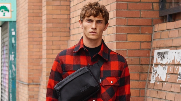 Luc Defont-Saviard sports a Sandro red and black checked jacket lined with faux sheepskin.