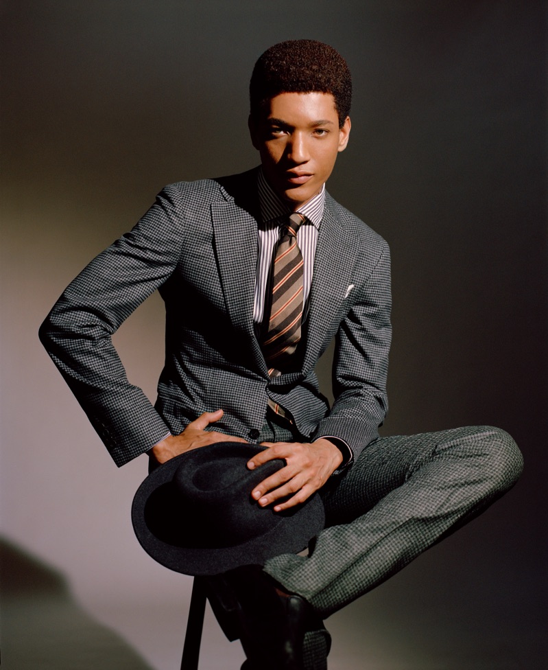 Peter Finn models a Canali suit, Ingram shirt, and Giorgio Armani hat.