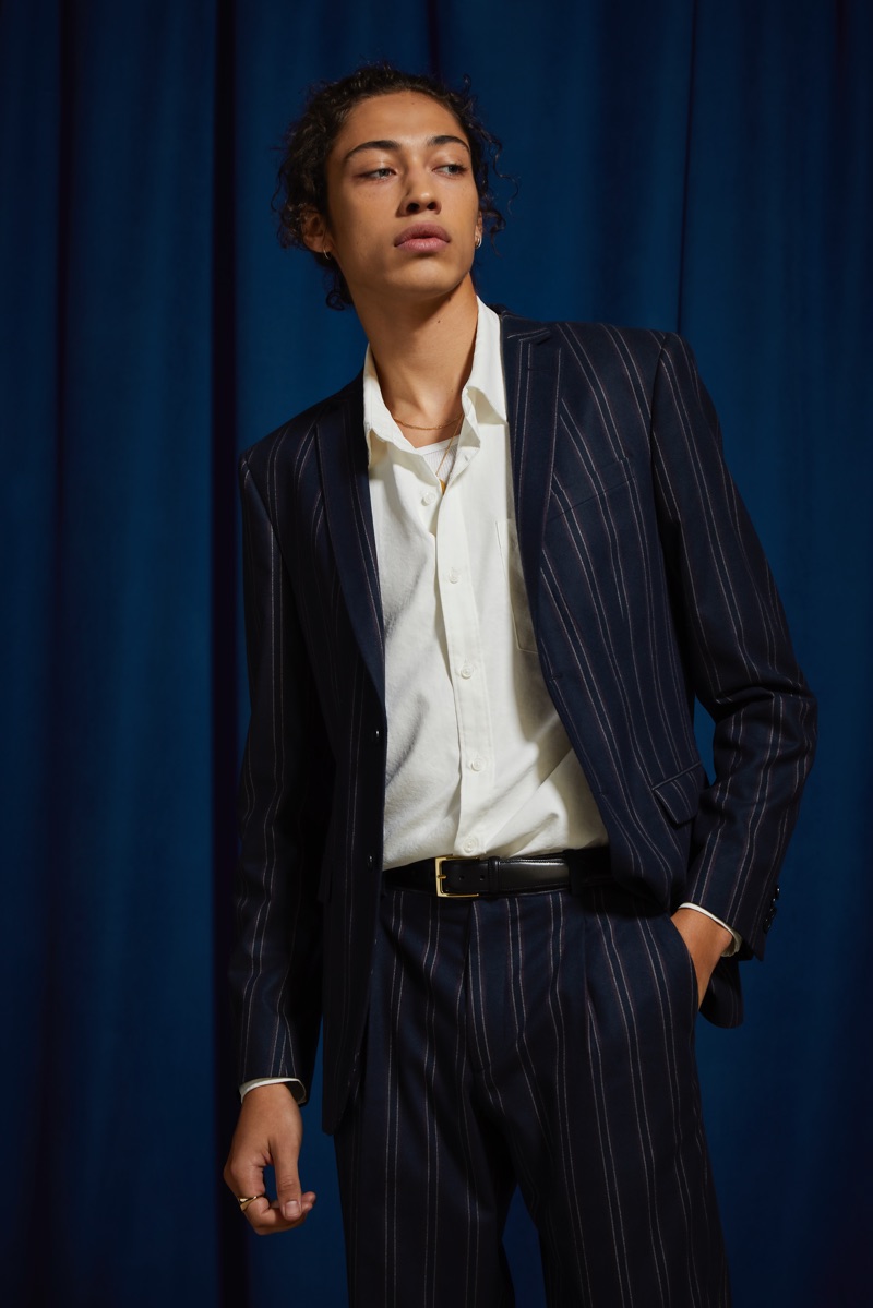 Making a case for pinstripes, Max Fieschi dons a navy pinstripe blazer and suit pants by UO.