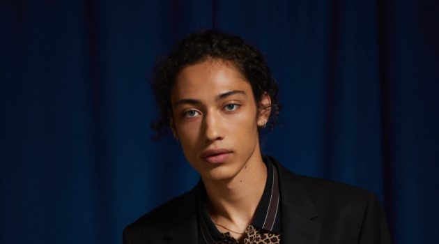 Urban Outfitters Introduces Men's Suit Shop Max Fieschi models an UO black skinny fit blazer and suit pants with a Lacoste leopard print polo.