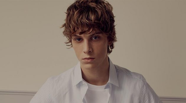 Serge Sergeev is the Valentino Man for Matches Fashion Front and center, Serge Sergeev rocks a Valentino striped shirt, logo-print t-shirt, tailored trousers, and sports socks.