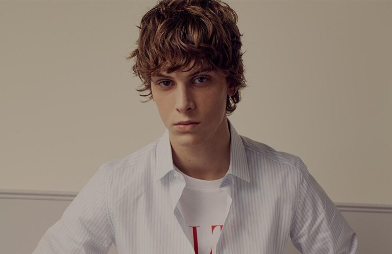 Serge Sergeev is the Valentino Man for Matches Fashion Front and center, Serge Sergeev rocks a Valentino striped shirt, logo-print t-shirt, tailored trousers, and sports socks.