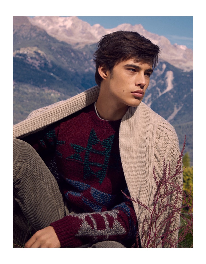 Louis Baines layers in knitwear from YOOX. He also sports corduroy pants.