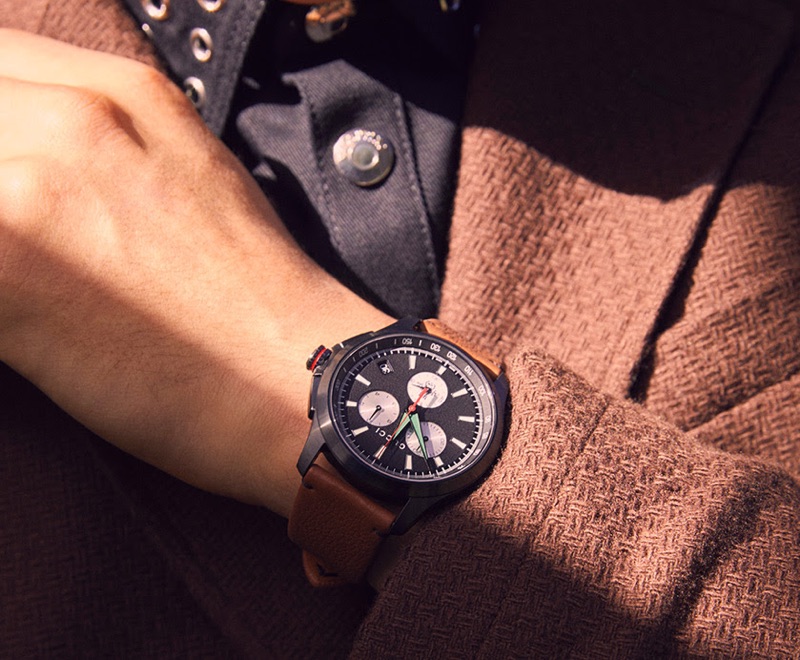 Drawing attention to accessories, YOOX spotlights a Gucci watch.
