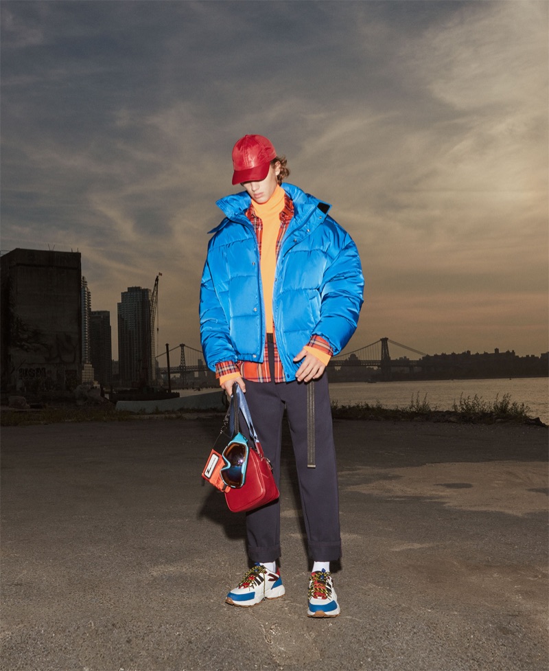 Model Theo Ford goes sporty in a puffer jacket look from Zara Man.