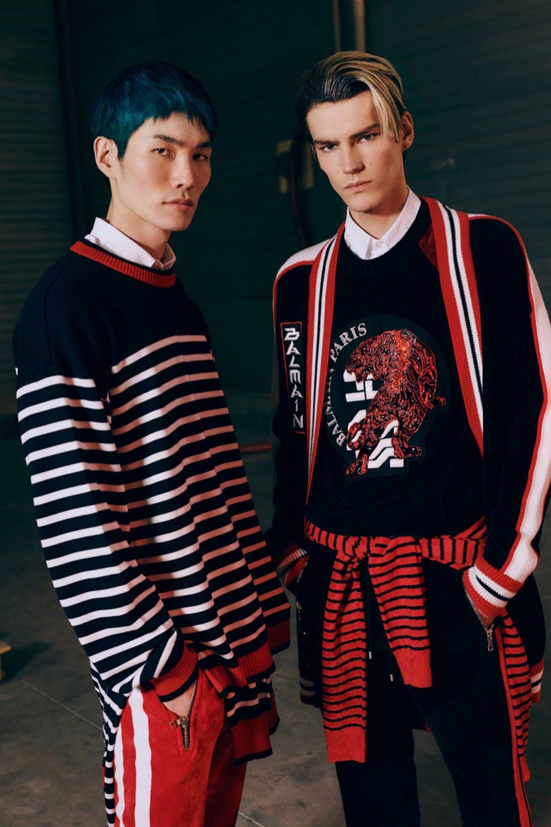 Jo Wonil and Elias de Poot don knitwear from Balmain's pre-fall 2019 men's collection.