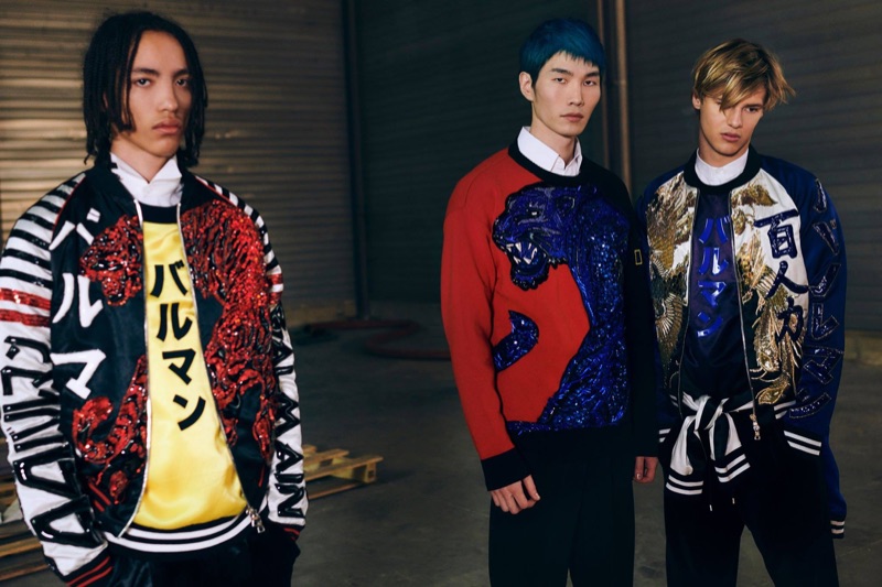 Models Andrew Nelson, Jo Wonil, and Emil Wikstrom don embellished jackets and pullovers from Balmain's pre-fall 2019 men's collection.
