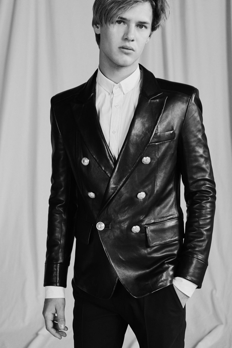 Front and center, Emil Wikstrom rocks a leather double-breasted jacket from Balmain's pre-fall 2019 men's collection.