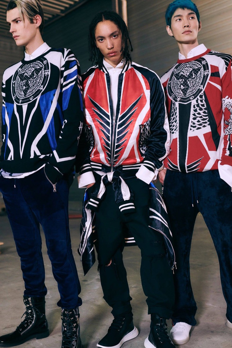 Embracing a streetwear-inspired edge, models Elias de Poot, Andrew Nelson, and Jo Wonil wear Balmain.