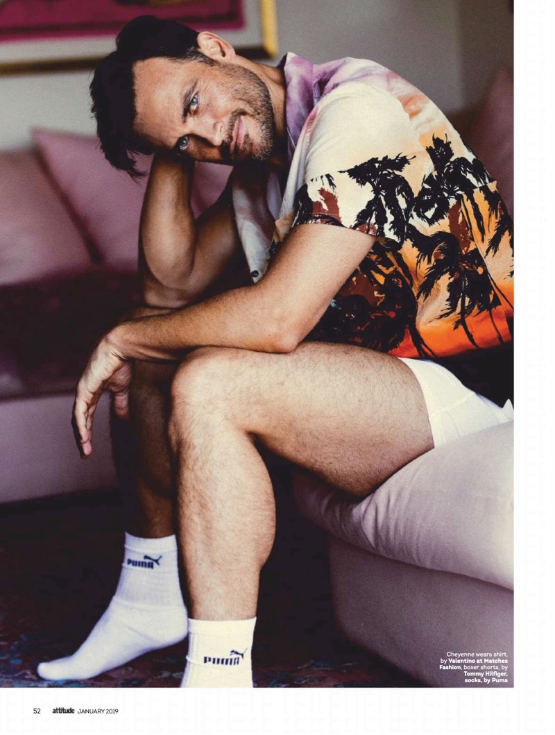 Relaxing indoors, Cheyenne Jackson dons a Valentino shirt, Tommy Hilfiger boxers, and Puma socks.