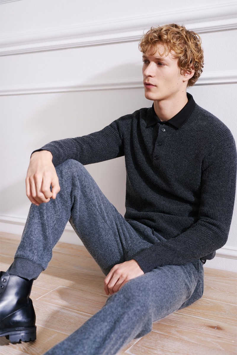 Layering for the cold, Sven de Vries sports a Club Monaco plaited henley sweater, brushed zip sweatpants, and a corduroy shirt. He also wears Wings & Horns officer boots.