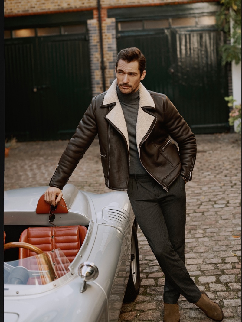 Effortlessly cool, David Gandy wears leather biker jacket with trousers from Mango.