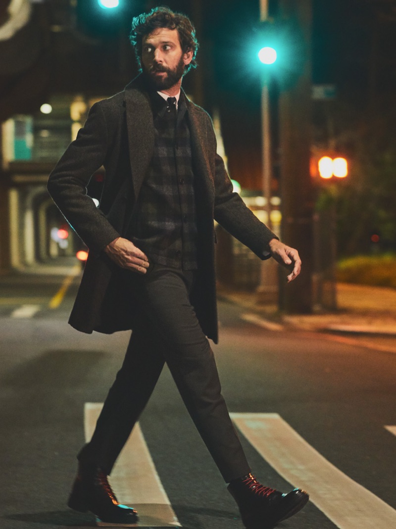 Out for a stroll, David Enrico dons a Marni sweater with a POLO Ralph Lauren shirt and Norse Projects jacket. He also sports a Theory coat, HUGO leather boots, as well as a Kenzo tie.