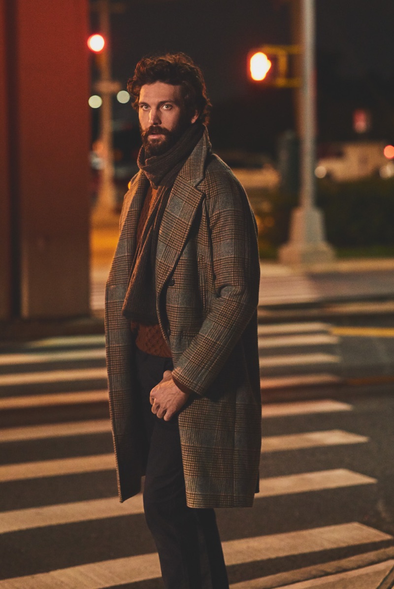 David Enrico wears a Billy Reid sweater and overcoat with Vince jeans and a Rag & Bone cashmere scarf.