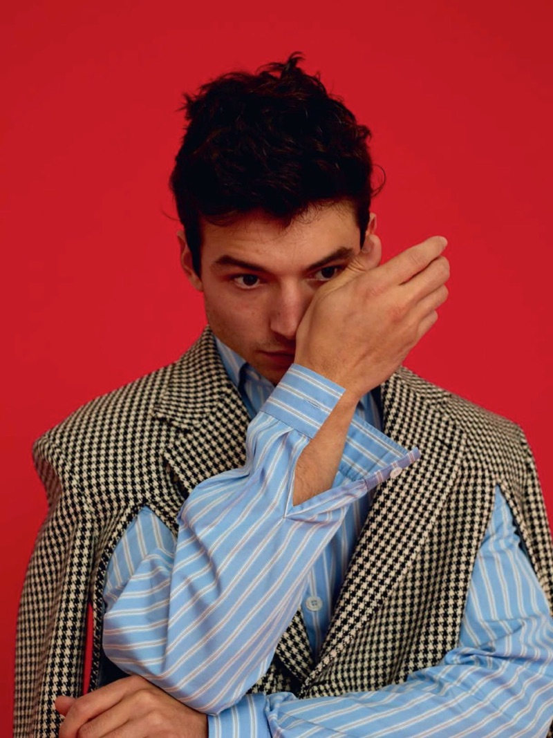 Actor Ezra Miller wears a shirt and jacket by Gucci.