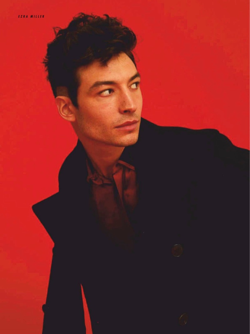 Starring in a photo shoot, Ezra Miller dons a Valentino double-breasted jacket and Saint Laurent shirt.