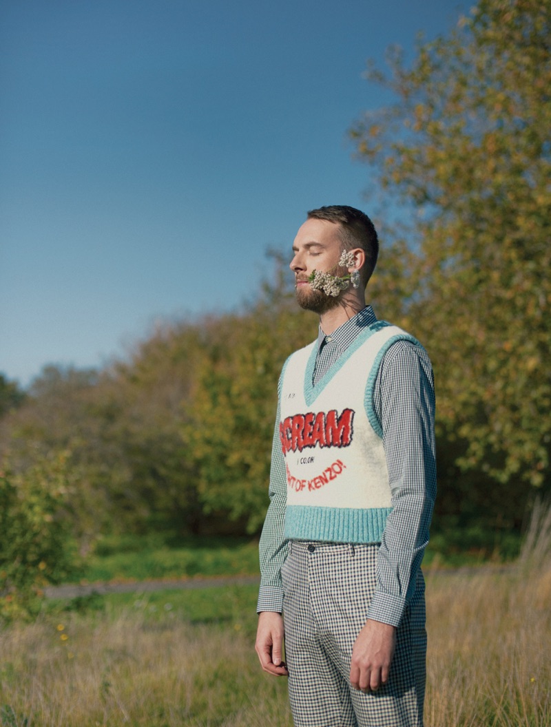 Andy Clutterbuck sports a sweater vest by Kenzo.