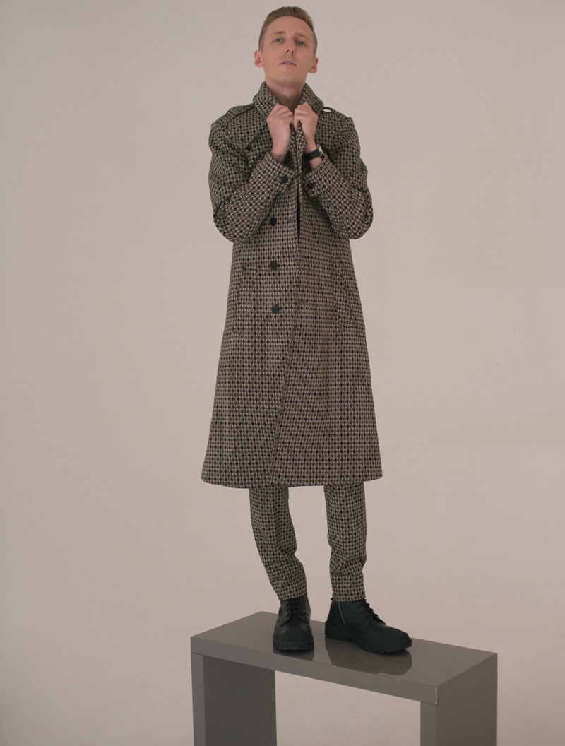 James Hatcher is sharp in a tailored coat for a fashion feature.