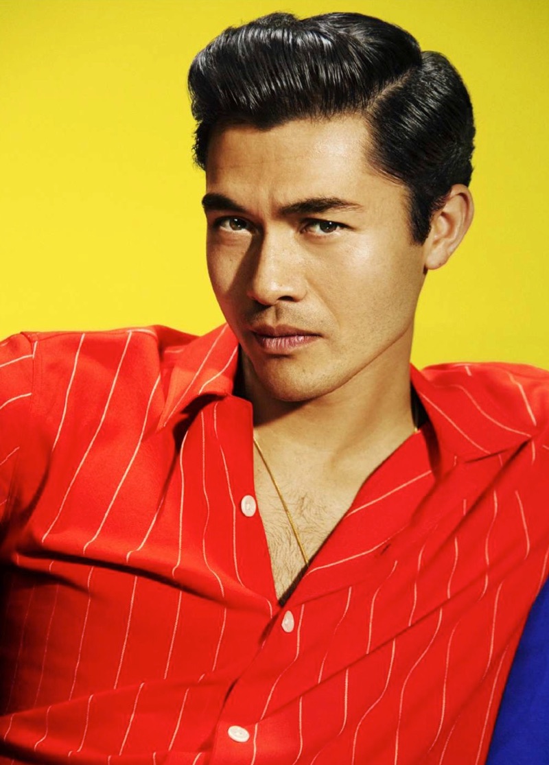 Actor Henry Golding wears an AMI shirt with his own necklace.