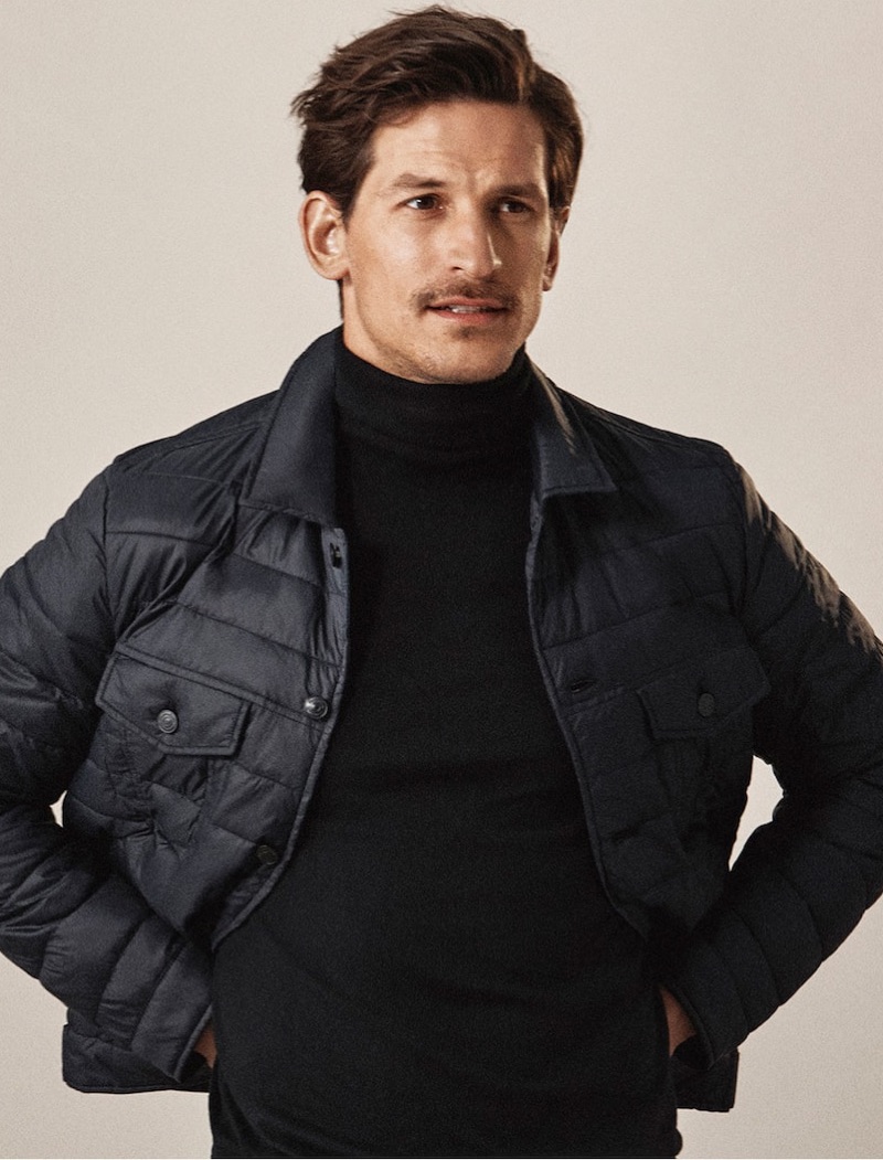 Top model Jarrod Scott wears a quilted jacket and turtleneck by Massimo Dutti.