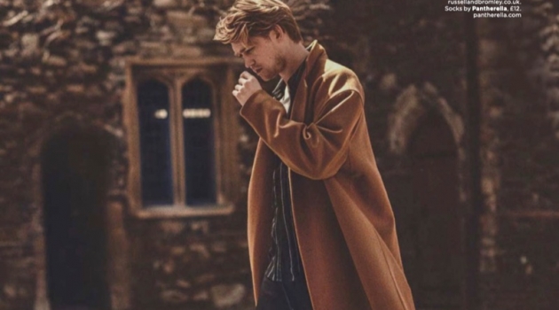 Joe Alwyn Stars in British GQ Shoot, Talks 'Operation Finale' Going for a stroll, Joe Alwyn wears a coat and trousers by The Kooples. He also dons an AMI shirt, Ron Dorff t-shirt, and Russell & Bromley shoes.