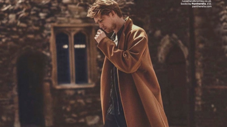 Going for a stroll, Joe Alwyn wears a coat and trousers by The Kooples. He also dons an AMI shirt, Ron Dorff t-shirt, and Russell & Bromley shoes.