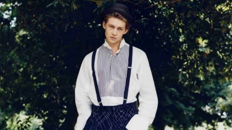 Joe Alwyn dons a Charvet shirt with Giorgio Armani trousers and a Lock & Co. Hatters hat.