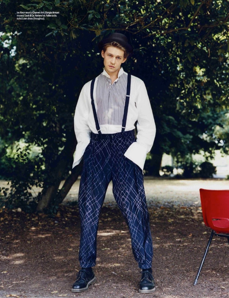 Joe Alwyn dons a Charvet shirt with Giorgio Armani trousers and a Lock & Co. Hatters hat.