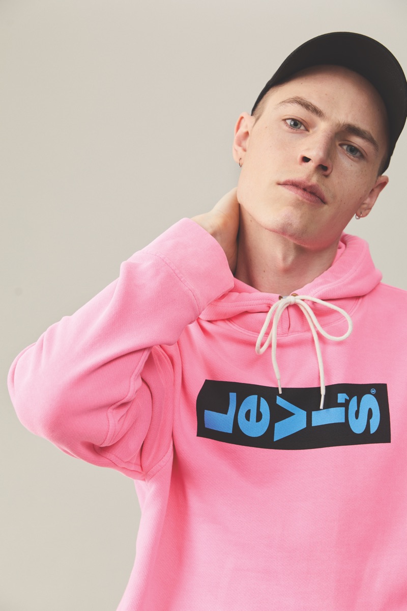 Jonas Kloch sports a pink Levi's logo hoodie from Levi's Red Tab's spring-summer 2019 collection.