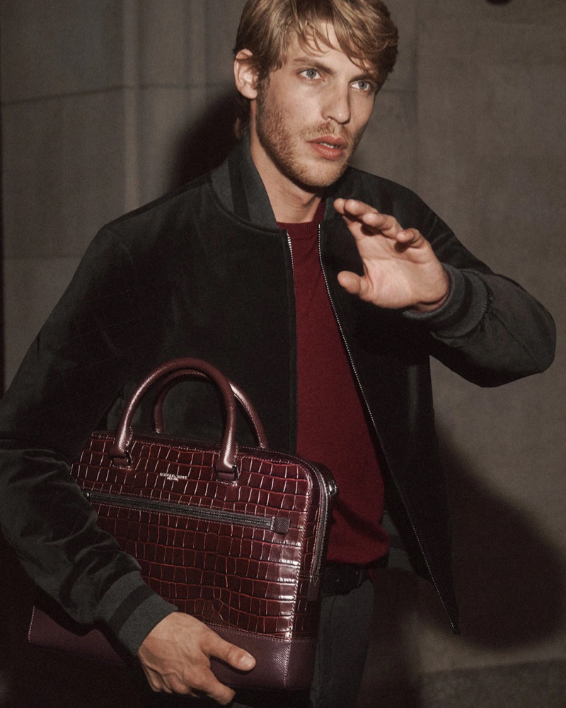 French model Baptiste Radufe sports a velvet bomber jacket for Michael Kors' holiday 2018 campaign.