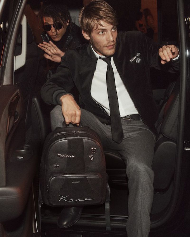 Models Baptiste Radufe and Roberto Rossellini front Michael Kors' holiday 2018 campaign.