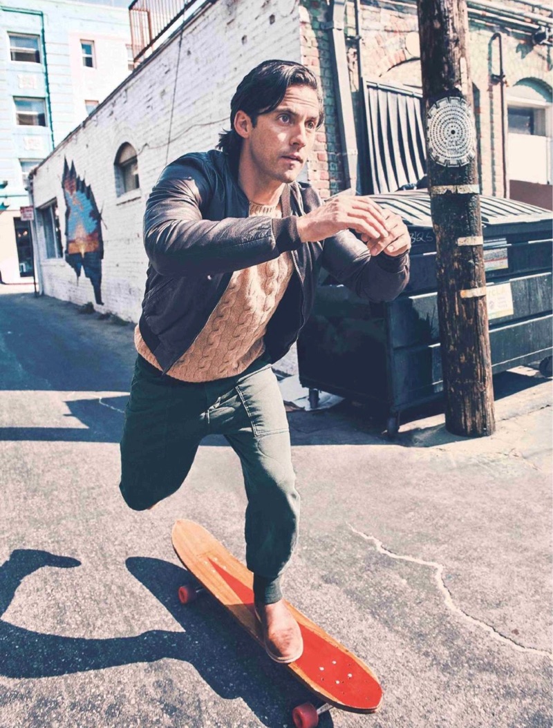 Skateboarding, Milo Ventimiglia sports a Ralph Lauren sweater, Double RL joggers, Red Wing shoes, and a Dolce & Gabbana jacket.