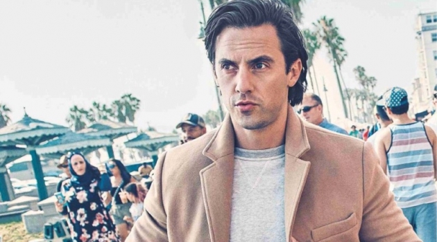 On the move, Milo Ventimiglia wears a Kelly Cole sweatshirt, Double RL joggers, and CK Jeans coat.